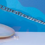 Bracelet homme multi mailles en acier argenté et perle en pampille